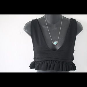 PrettyLittleThing Black Frill Hem Plunged Cropped Top